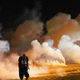 Demonstrators, protesting the shooting death of teenager Michael Brown, flee as police shoot tear gas into the crowd of several hundred after someone reportedly threw a bottle at the line of police Aug. 13, 2014, in Ferguson, Mo.
Scott Olson/Getty Images
